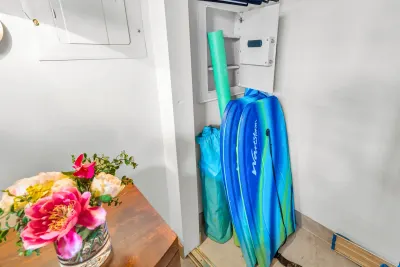 Owner's closet with boogie boards and beach gear for guests