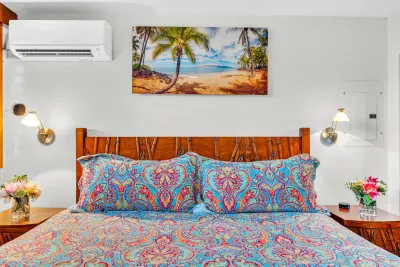 Bedroom with split-system air conditioning above the bed