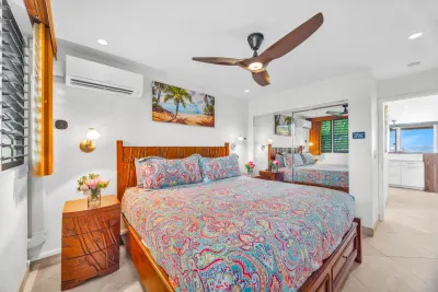 Bedroom with a king bed and ceiling fan