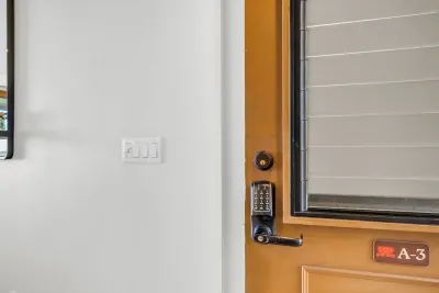 Entry door to unit A3 with a keypad lock