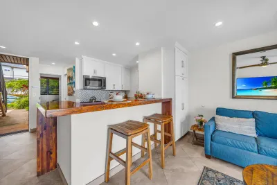 Breakfast bar with stools looking into the living room