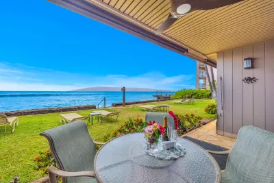 Lanai dining table with the ocean beyond