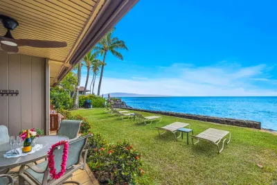 The lanai looking out over the lawn and loungers