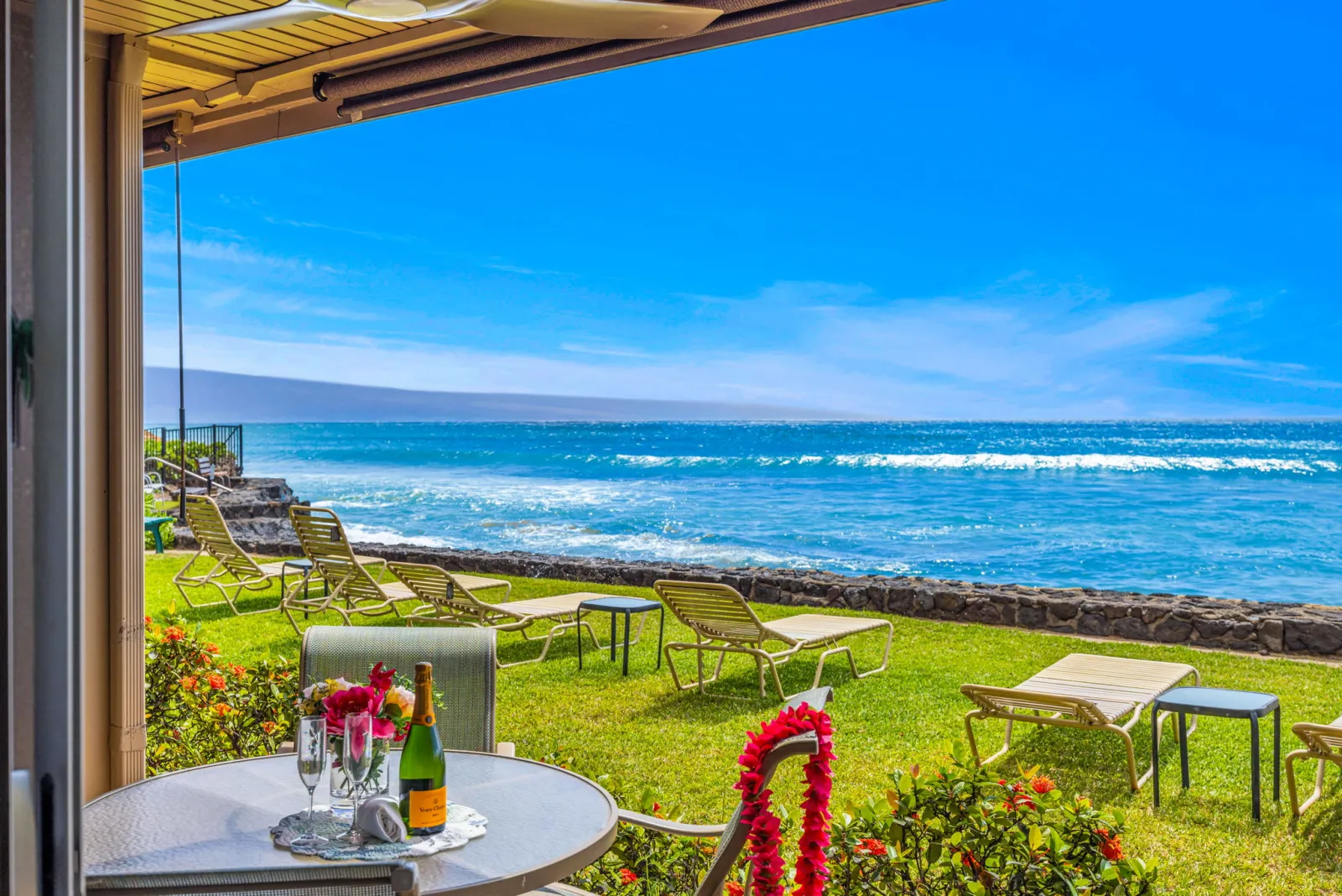 The lanai looking out across the lawn to the Pacific