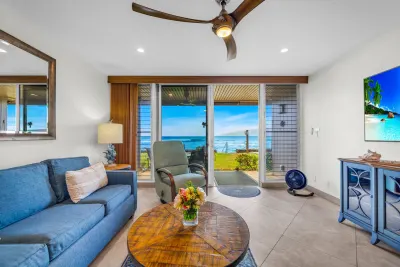 Living room with a round dining table and ocean view
