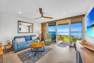Living room opening onto the lanai and the ocean beyond