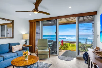 Living room looking through the sliding doors to the ocean